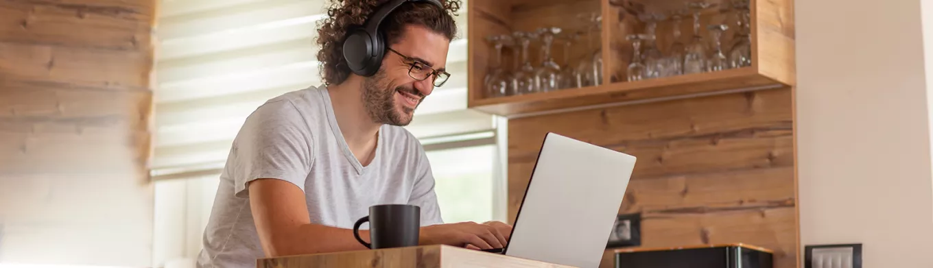 Man working at home and looking happy 