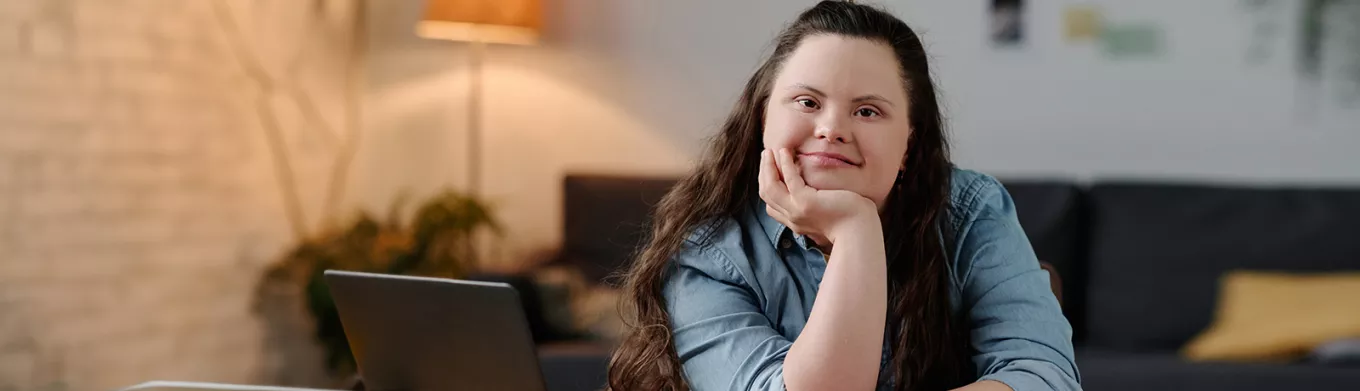 Neurodiverse girl sitting at a desk 