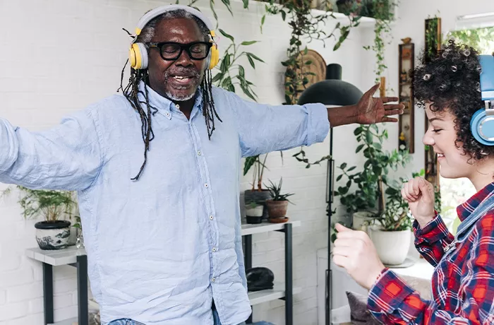 Happy black man and white woman dancing