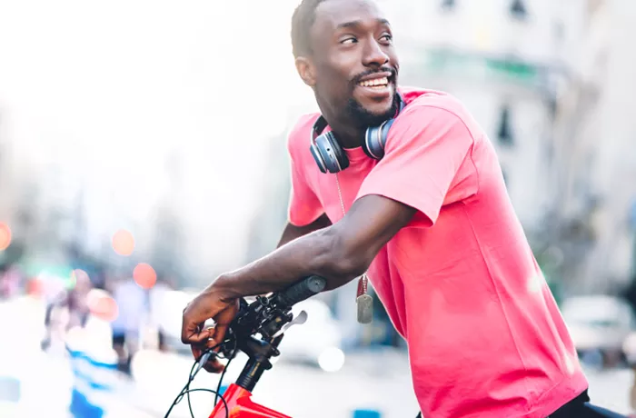 black man riding a bike