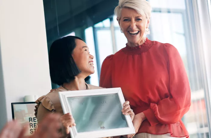 Giving a certificate to a female employee 