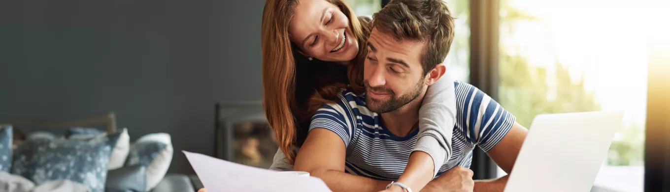 Man and woman checking their finances 