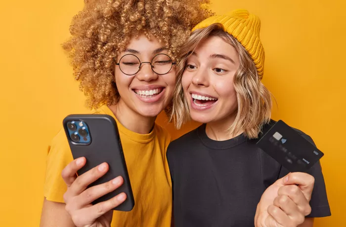 Happy and smiling women with a phone