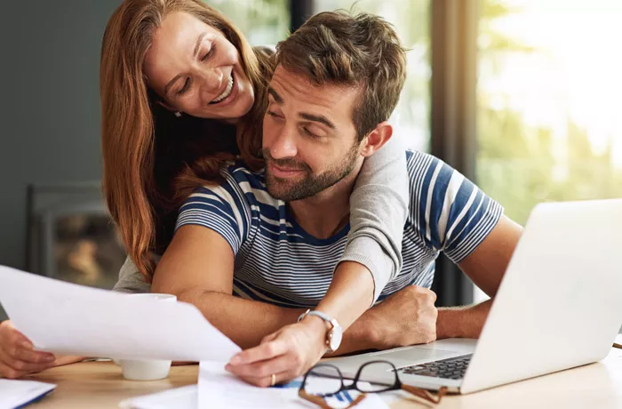 Man and woman checking their finances