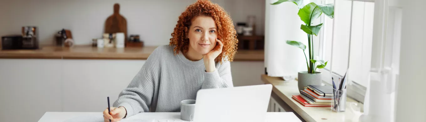 woman sitting at desk working from home 