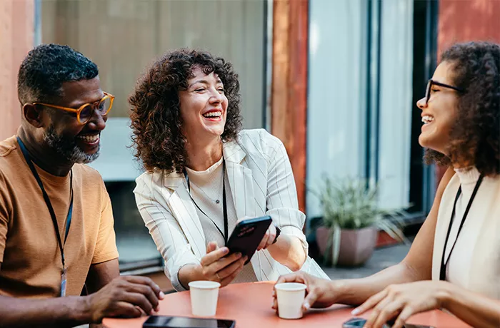 group of colleagues having a coffee and happy chat 