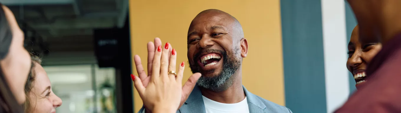 People in the office giving a high-five 