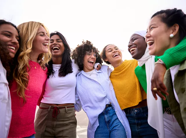 group of young women embracing each other 