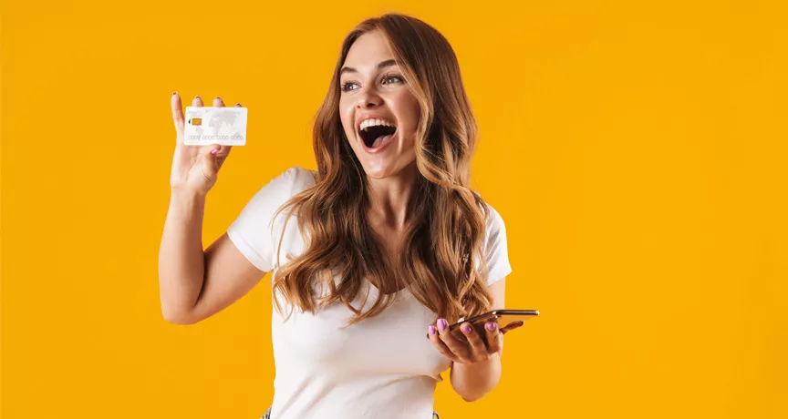 girl holding card and smiling