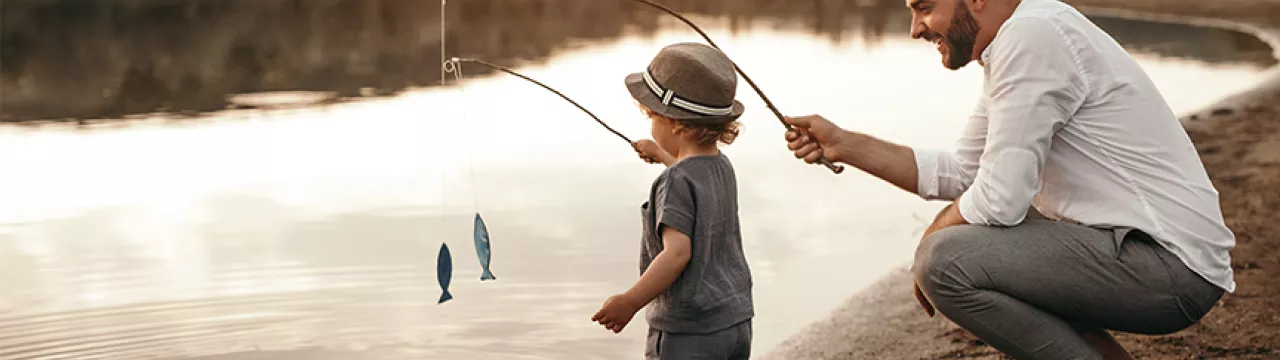 Father fishing with son