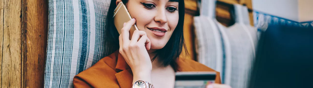 woman shopping with her card on phone