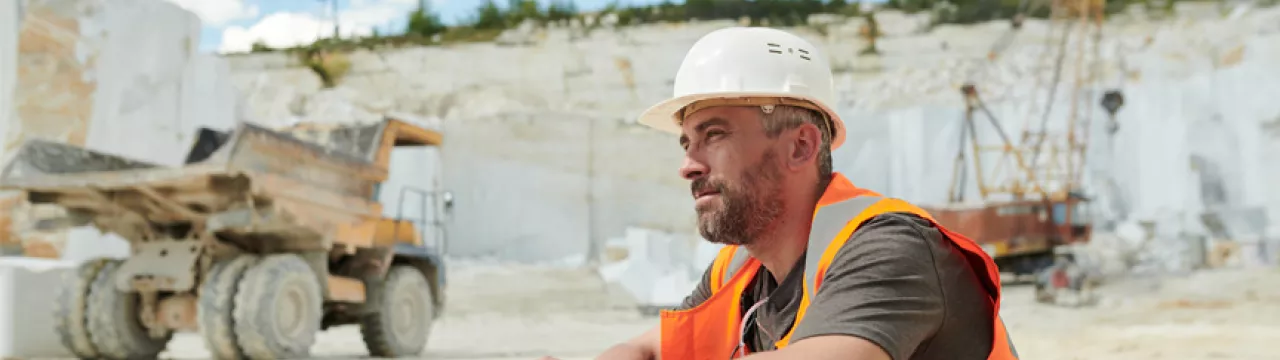man sitting down in a quarry