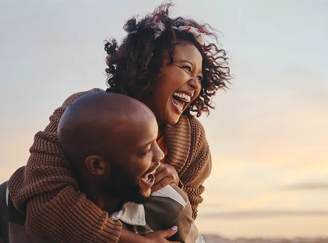 Couple on holiday -Stretch their Salaries Further