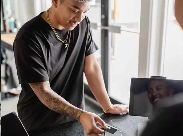 man spending money in shop