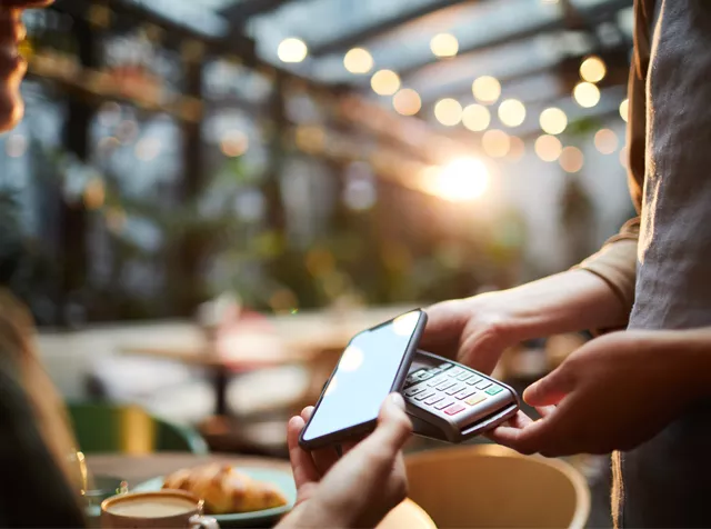 person paying for goods with phone