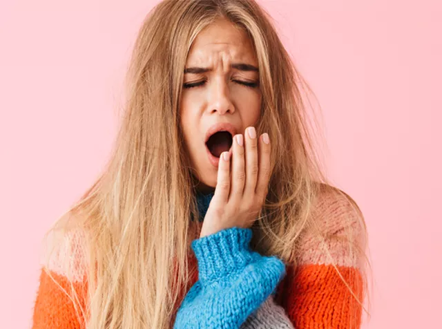 smaller image of woman yawning