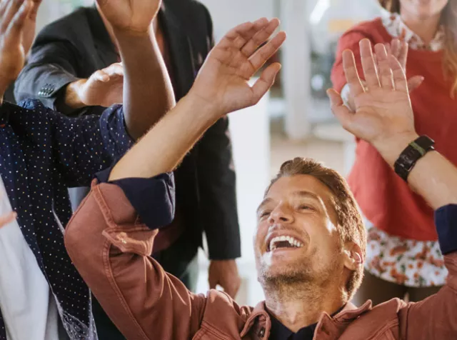 team celebrating at work