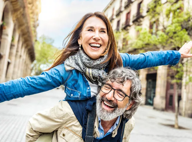 man giving woman a piggy back