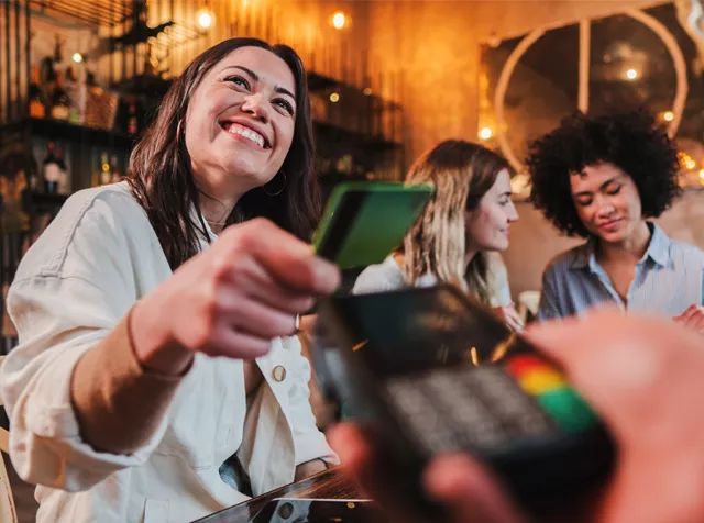 paying for a meal with a card