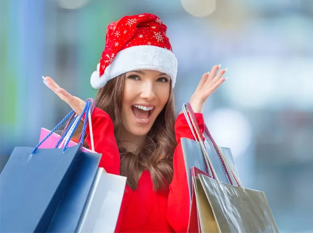 woman doing lots of Xmas shopping