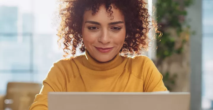 Happy woman on laptop