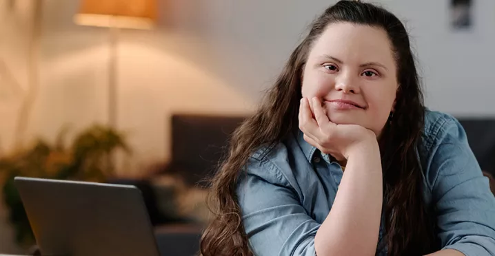 Neurodiverse girl sitting at a desk