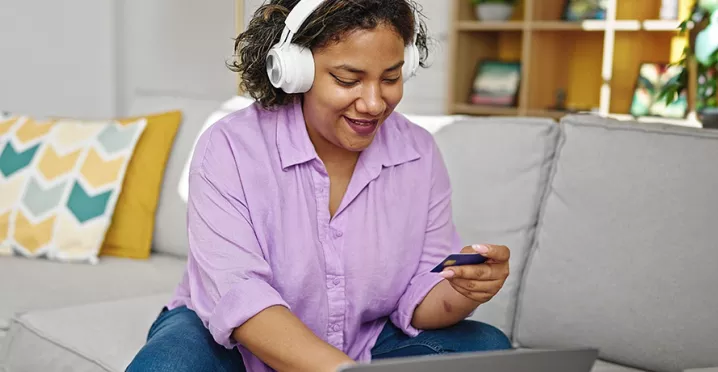 women purchasing something online with her card