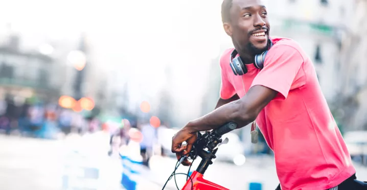 Black man on a bike