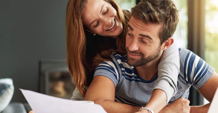 Man and woman checking their finances