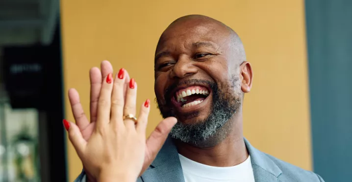 People in the office giving a high-five