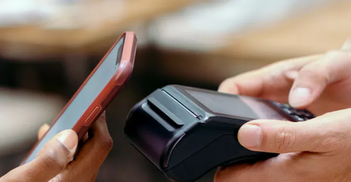 Person contactless paying using their phone