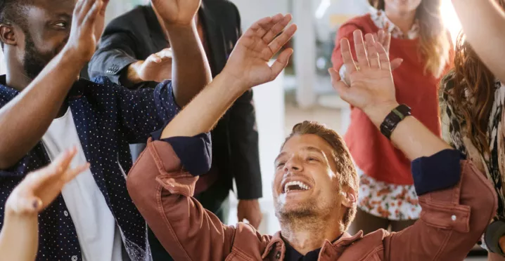 team celebrating at work