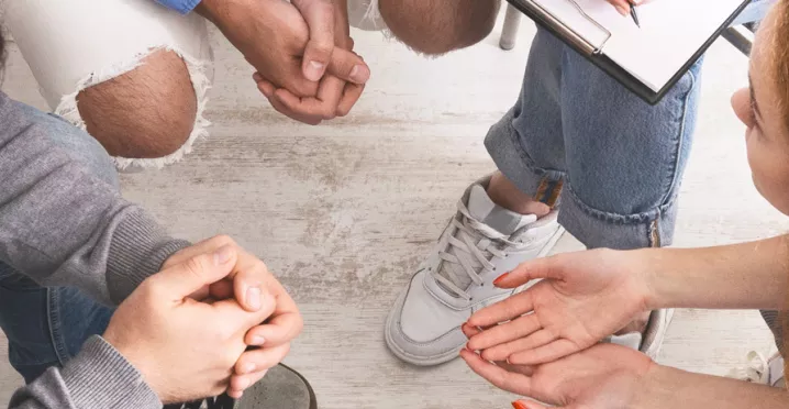 Group of people sitting in a circle talking