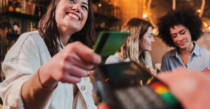 paying for a meal with a card