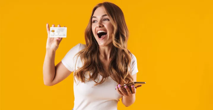 girl holding card and smiling