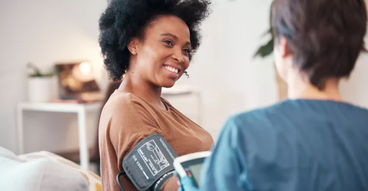 woman having her blood pressure tested