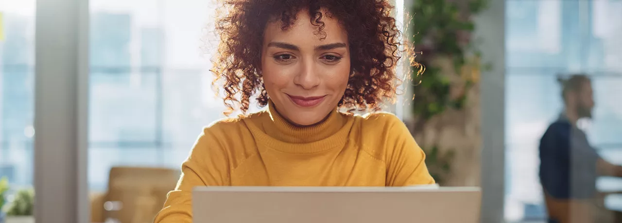 Happy woman on laptop
