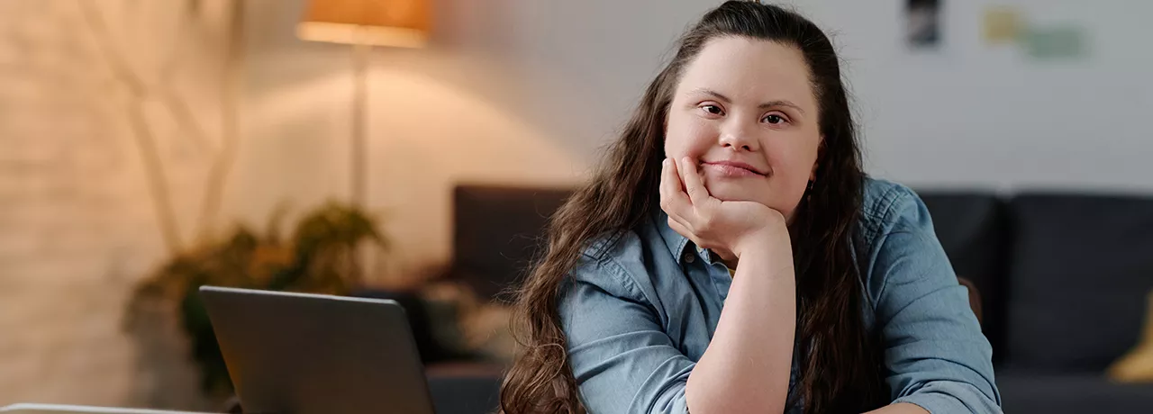 Neurodiverse girl sitting at a desk