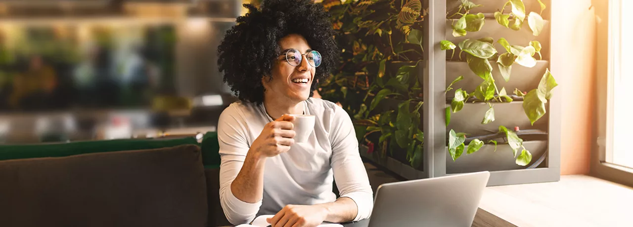 Woman sitting at home working on laptop