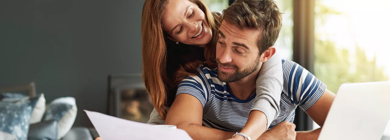 Man and woman checking their finances