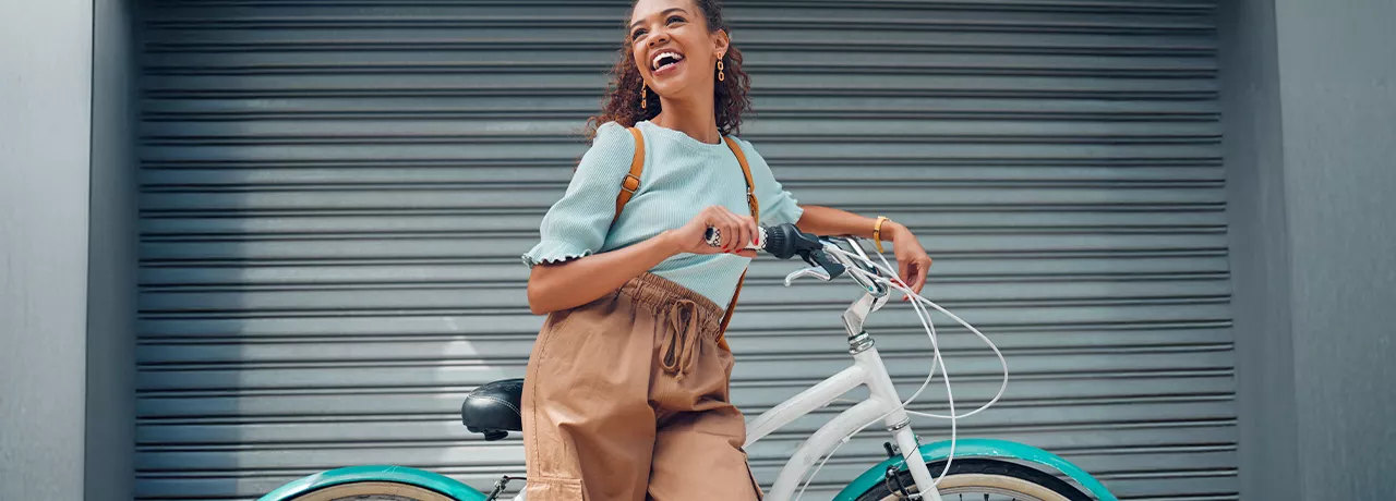 woman leaning against a bike