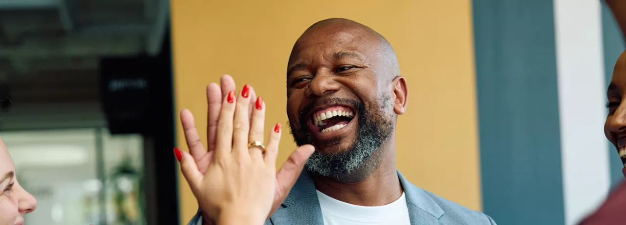 People in the office giving a high-five