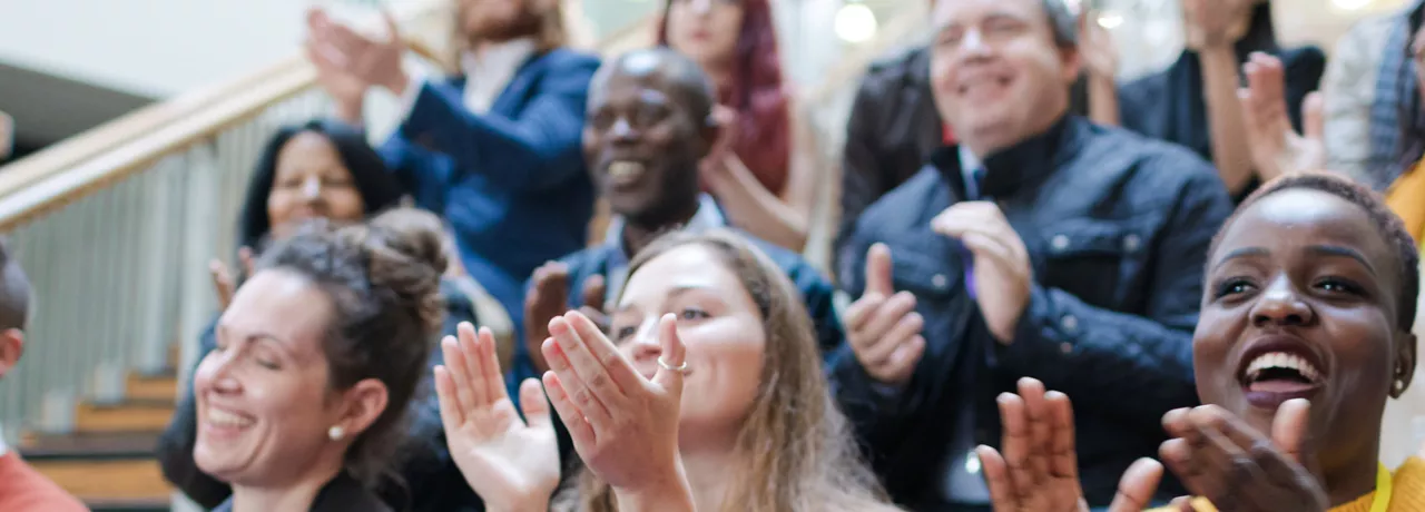 Group of people clapping