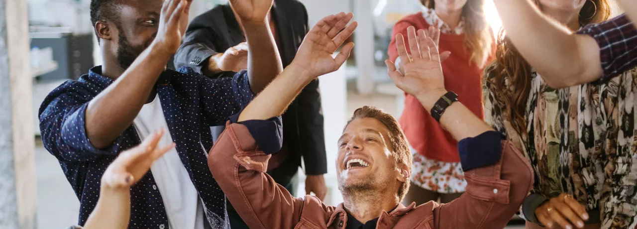 team celebrating at work