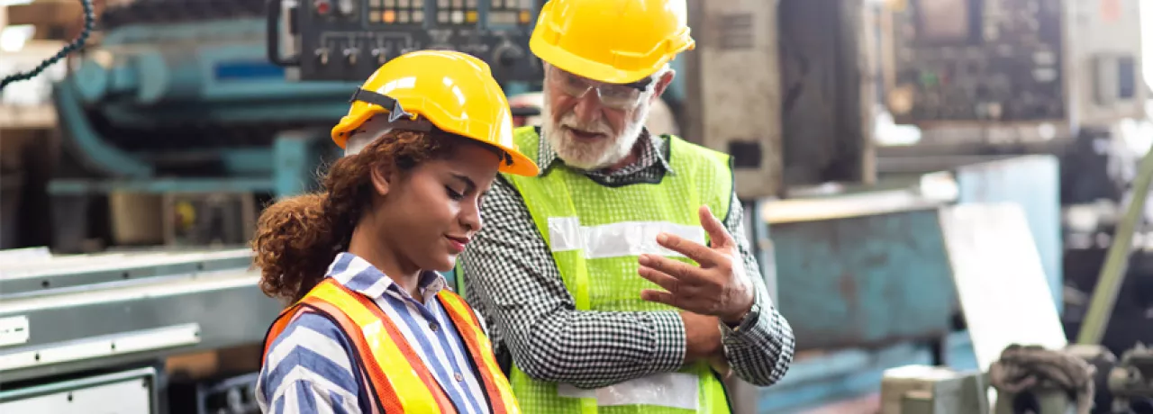 man and woman in a factory