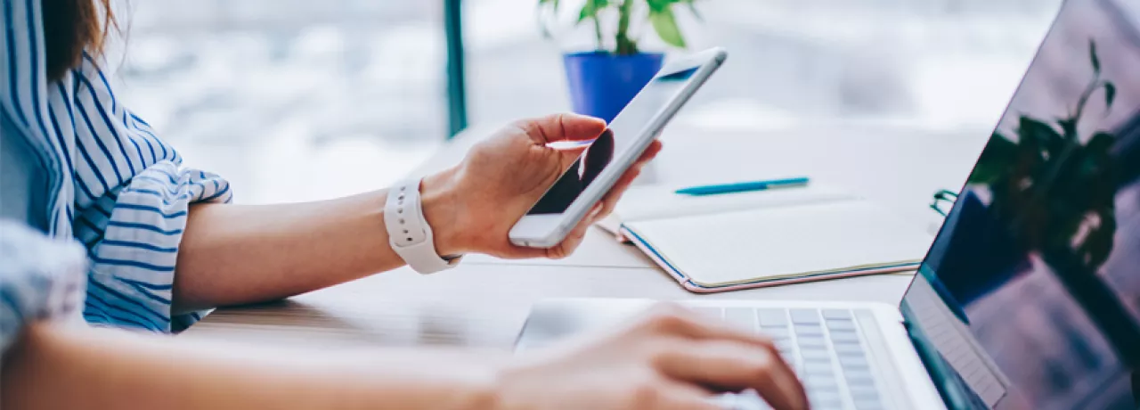 blog upload - woman on phone and laptop