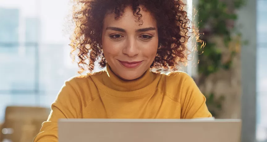 Happy woman on laptop