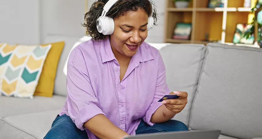 women purchasing something online with her card