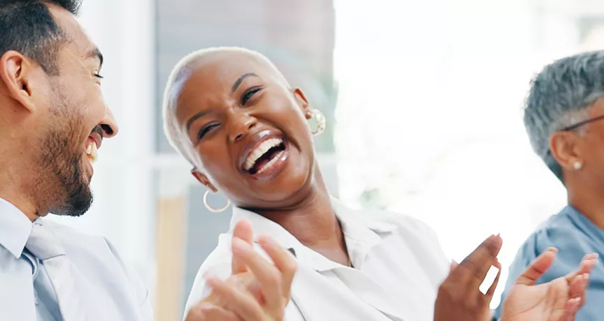 Group of happy employees clapping