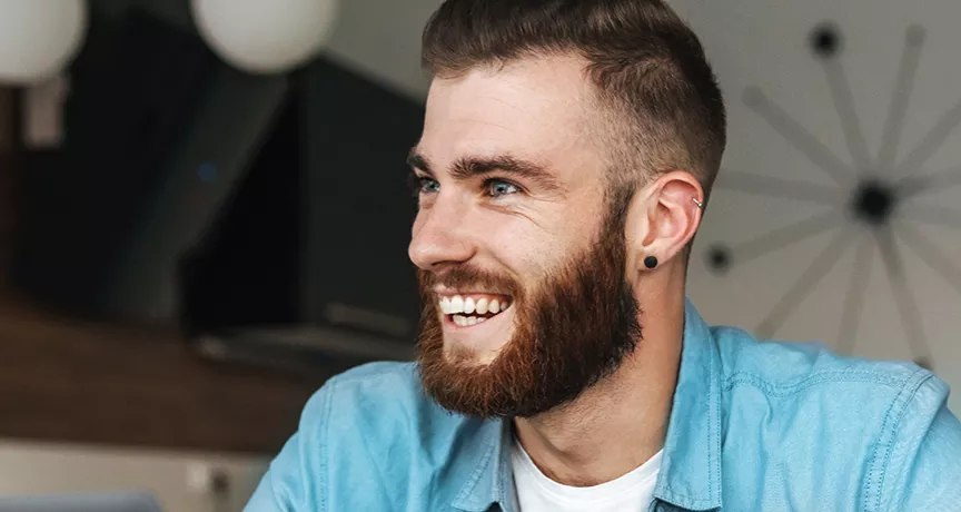 Happy man sitting at his desk